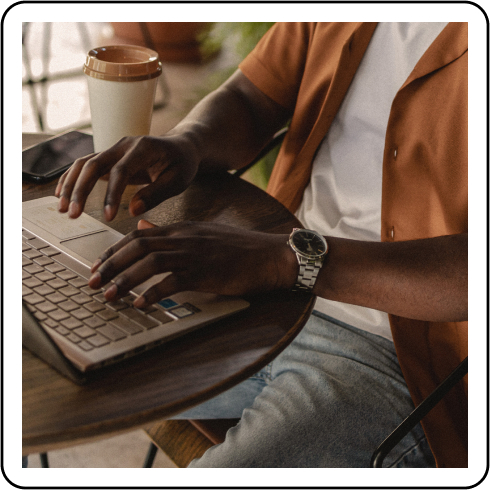 Image description: A person typing on a laptop.
